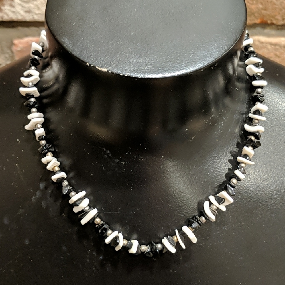 White, black, and silver necklace